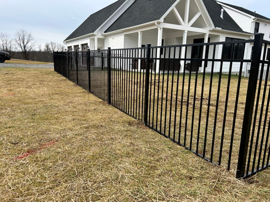 Black Aluminum fence around house.