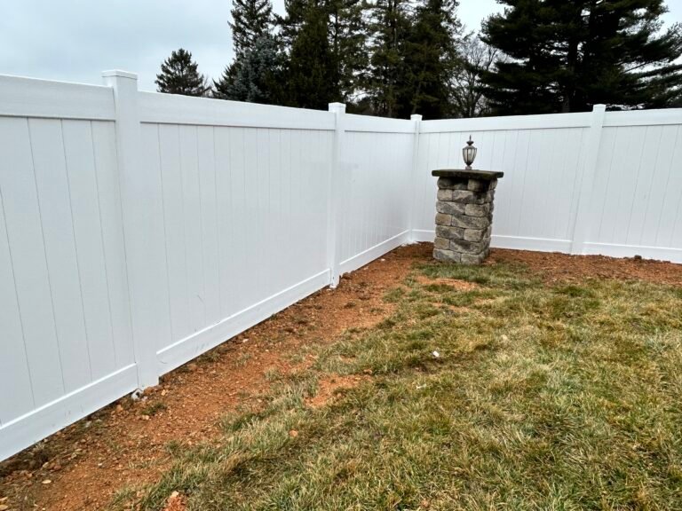 White vinyl fence just installed.